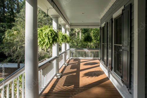 Wrap around porch on beautiful luxury home. photo