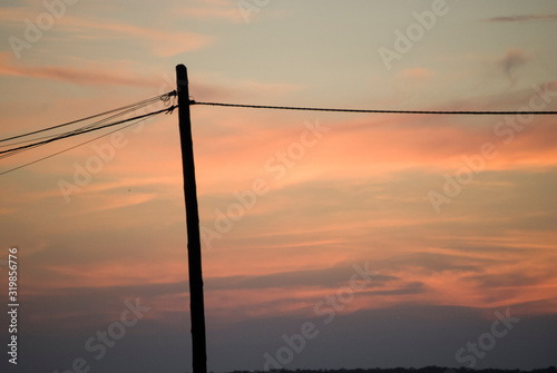 Post while sunset © David