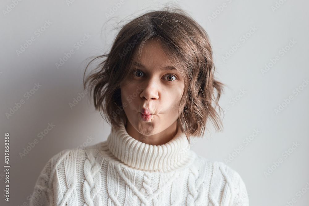 Surprised girl makes lips tube Surprised girl makes lips tube