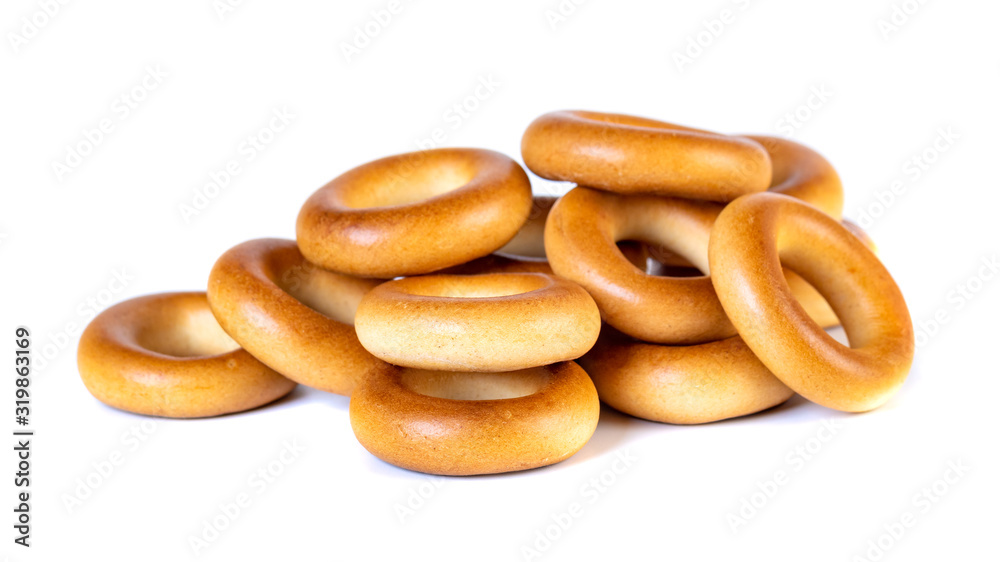 Small dry bagels, small rolls on a white background Small dry bagels, small rolls on a white background