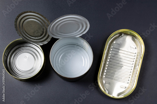 Empty tin cans close up on a black background