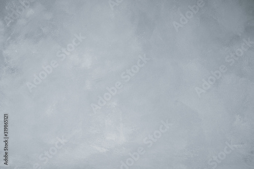 Gray artistic canvas backdrop. Abstract painted stained monochrome background.