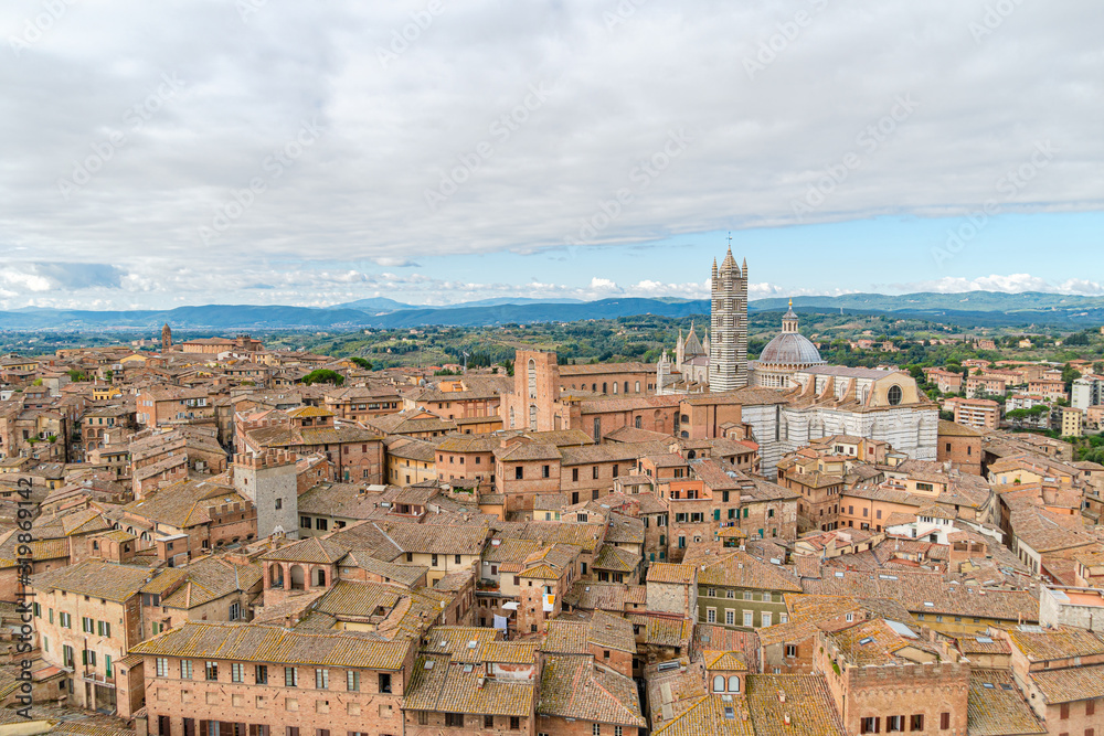 Scenery of Siena, a beautiful medieval town in Tuscany, with view of the Dome and Bell Tower of Siena Cathedral, Italy