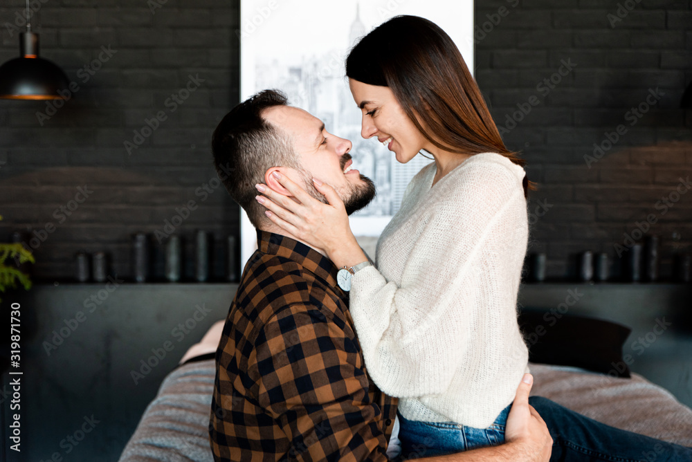love story at bedroom. Couple in love on bed