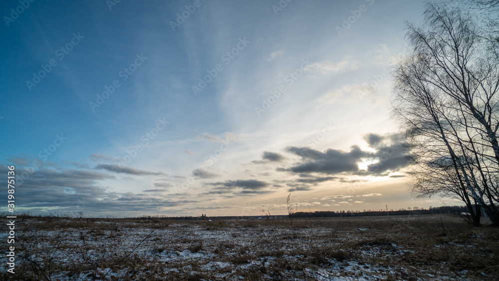 Beautiful setting sun over frozen field Beautiful setting sun over frozen field