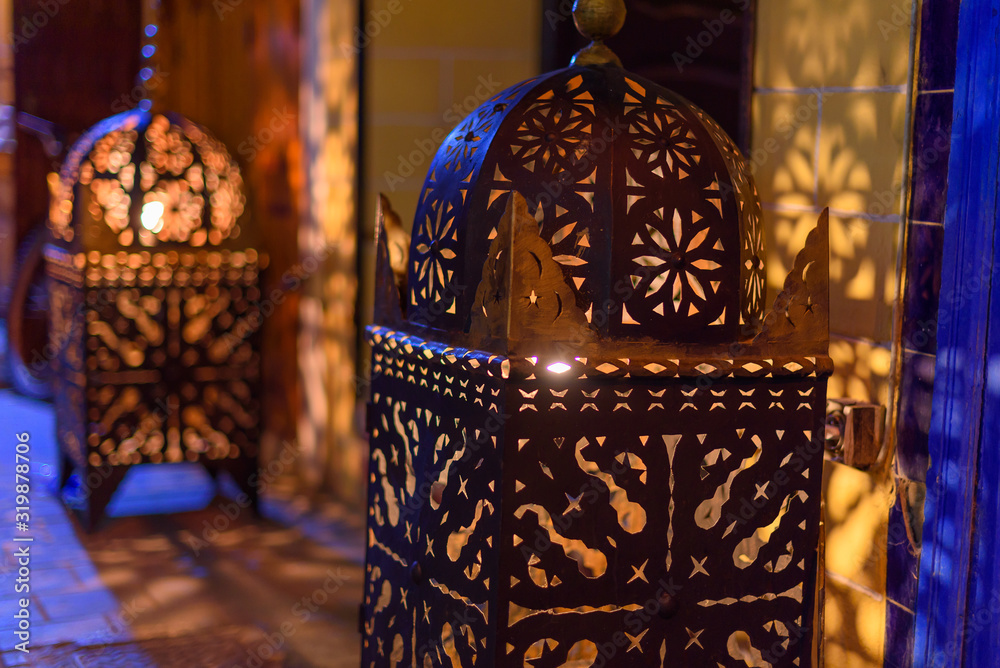 Richly decorated with traditional Moroccan lamp. Moroccan lantern lamp on  the night street in Essaouira Stock Photo | Adobe Stock