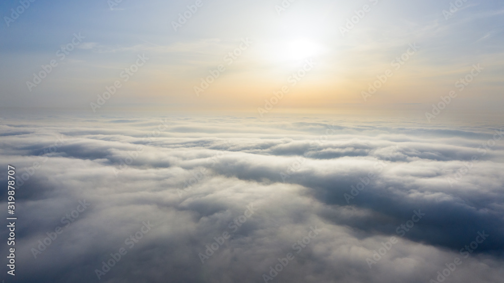 Yellow and blue dawn over clouds, concept, travel and leisure. - obrazy, fototapety, plakaty 