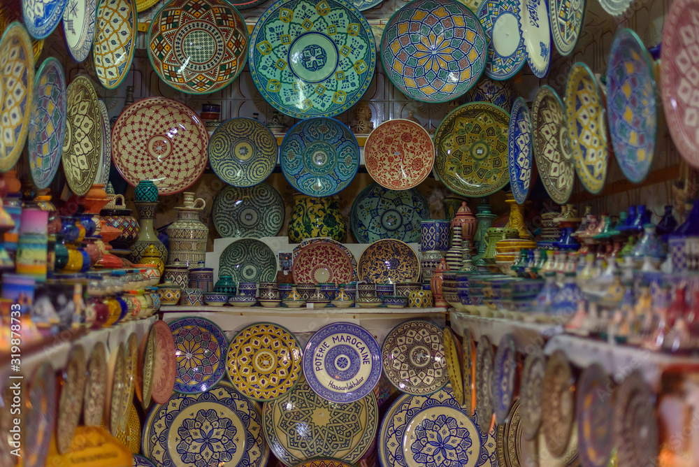 Traditional ceramic Oriental kitchenware on the wall of the Bazaar of Morocco.