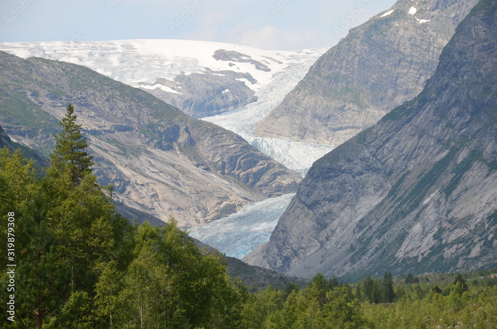 Fototapeta premium Nigardsbreen is another famous language of Jostedalsbreen. Like other glaciers, it melts, forming a powerful river - an impressive sight!