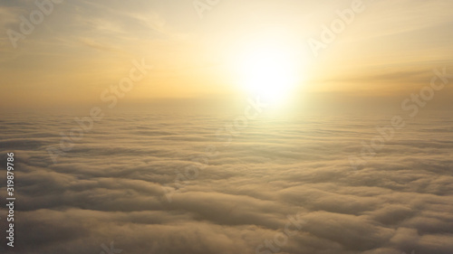 Yellow and blue dawn over clouds  concept  travel and leisure.