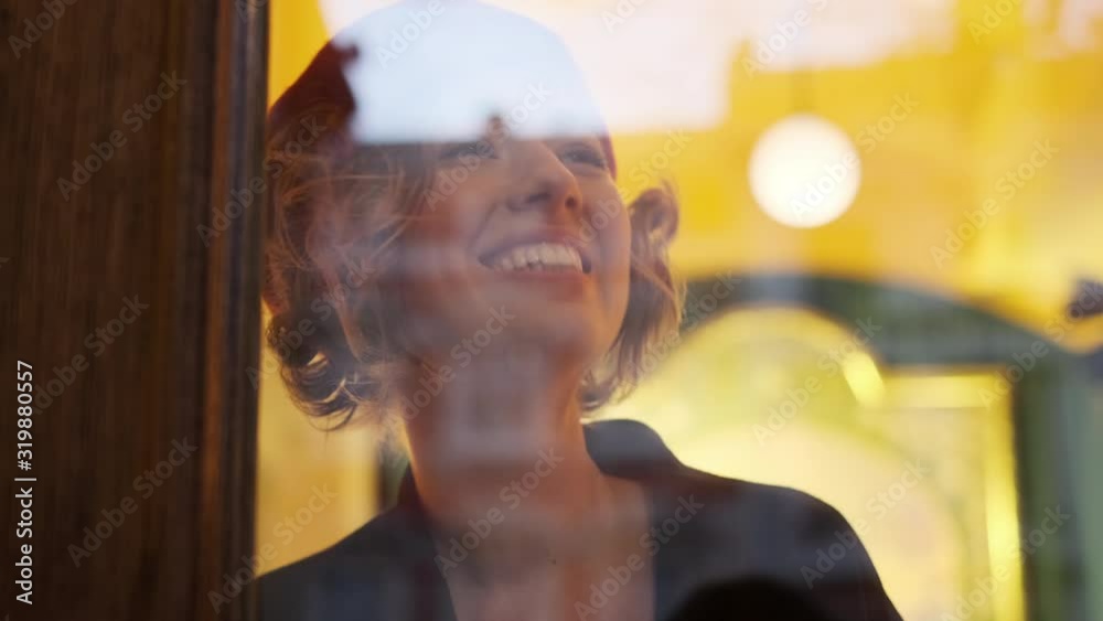 Young Romantic Girl Looking Through The Window Glass. Young Romantic Girl Looking Through The Window Glass.