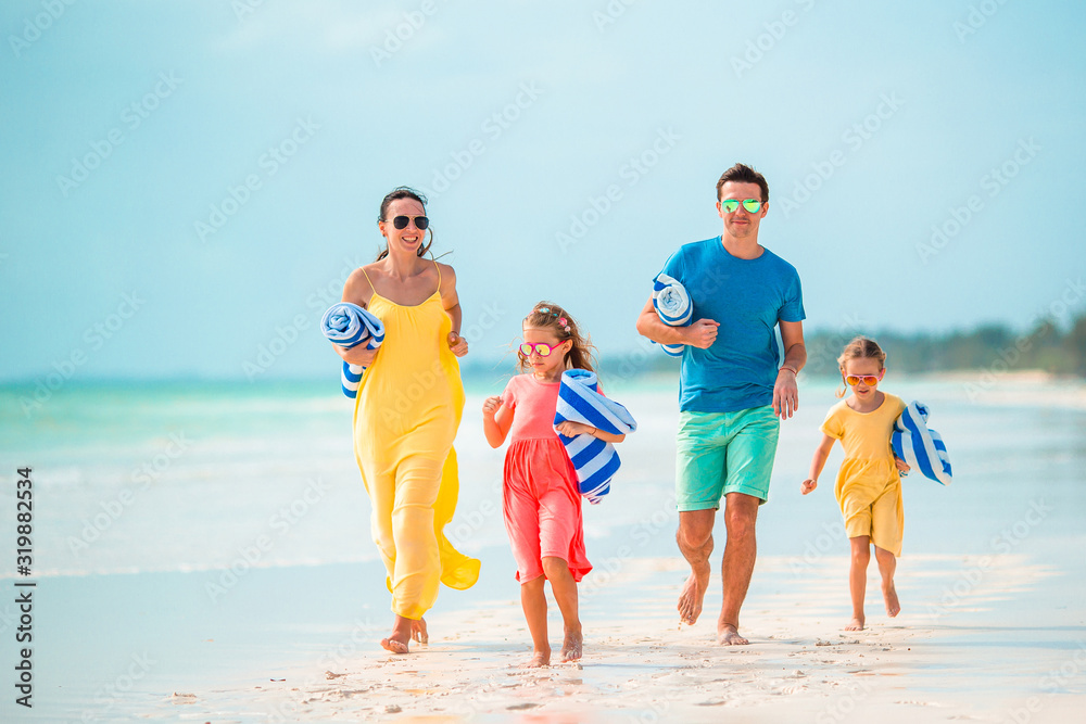 Young family on vacation on the beach