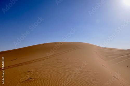 Sand dune with interesting shades and texture in Sahara during midday sun, Morocco, Africa