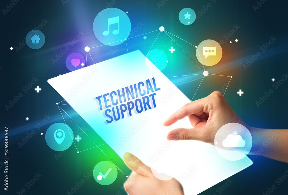 Holding futuristic tablet with TECHNICAL SUPPORT inscription, new technology concept Holding futuristic tablet with TECHNICAL SUPPORT inscription, new technology concept