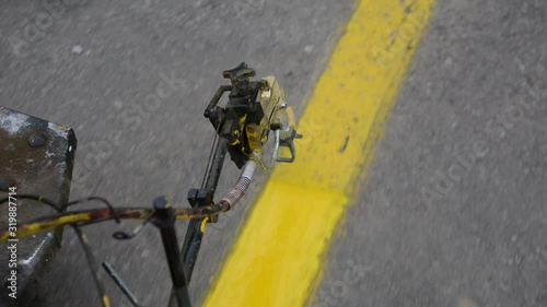 Machine eject on road traffic sign painting.