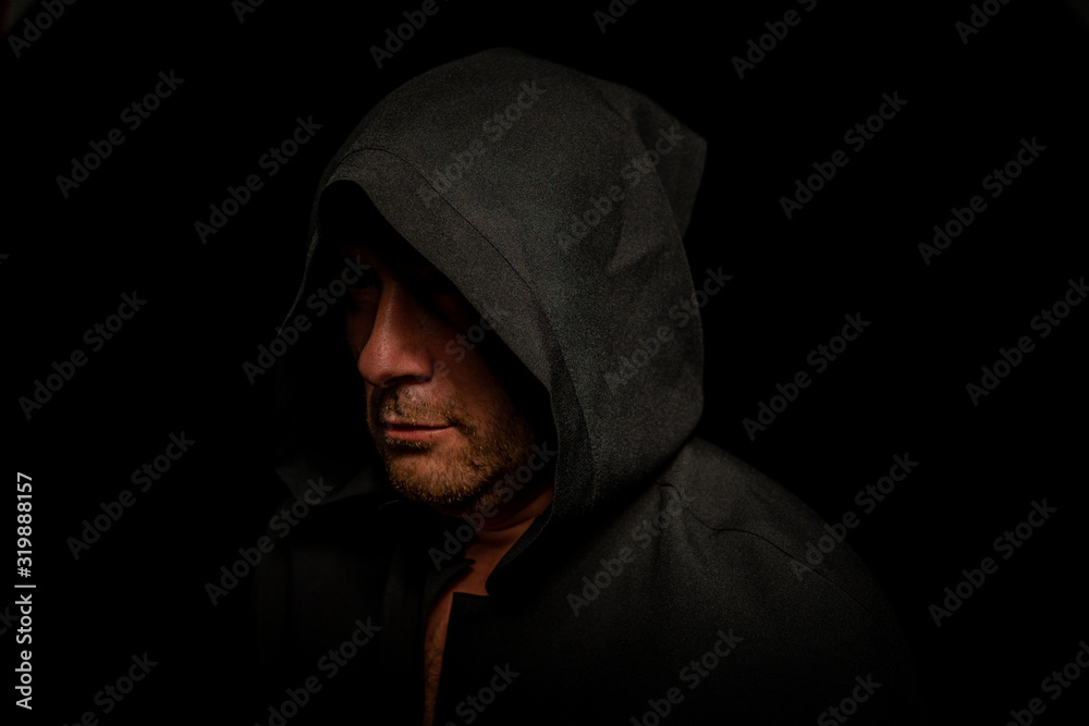 Portrait of a courageous warrior wanderer in a black cloak. Historical fantasy. Halloween Portrait of a courageous warrior wanderer in a black cloak. Historical fantasy. Halloween