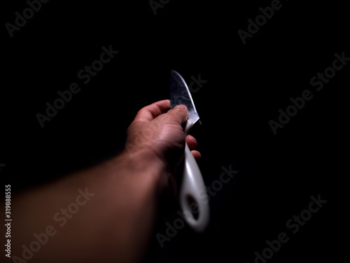 Hand holding a knife 