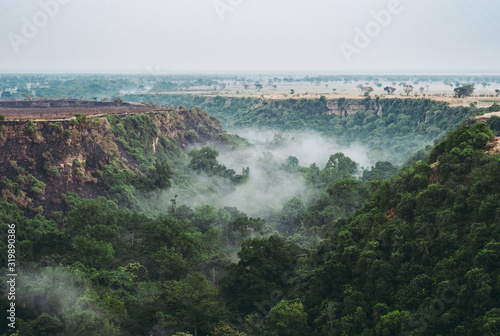 Kyambura Gorge in Queen Elisabeth National Park with Fog and Rainforest photo