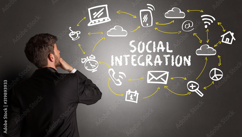 businessman drawing social media icons with SOCIAL INTEGRATION inscription, new media concept businessman drawing social media icons with SOCIAL INTEGRATION inscription, new media concept