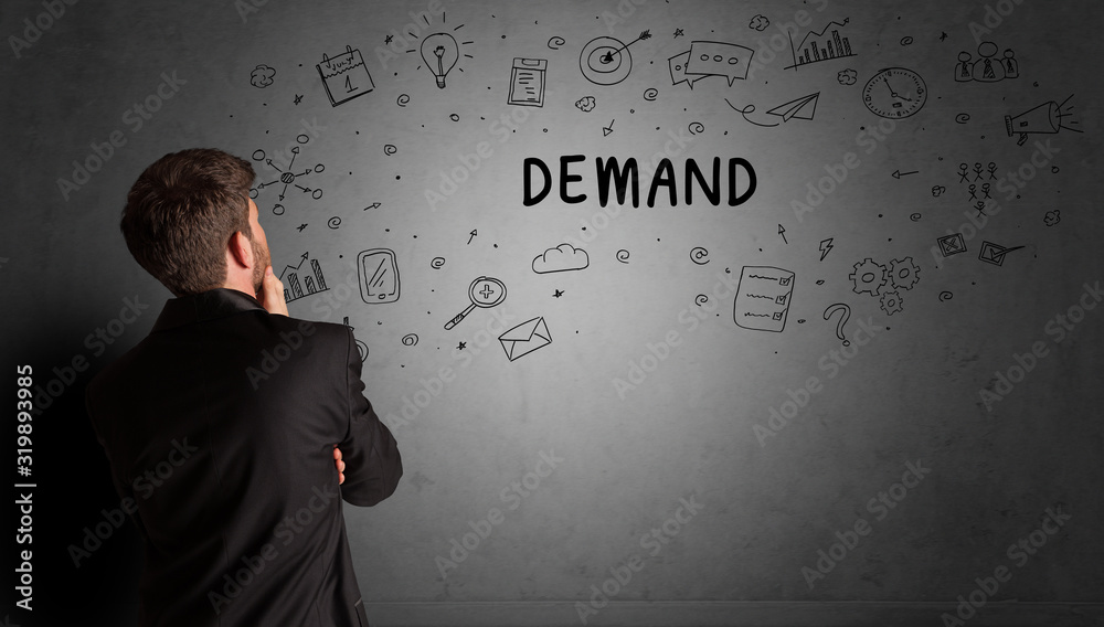 businessman drawing a creative idea sketch with DEMAND inscription, business strategy concept businessman drawing a creative idea sketch with DEMAND inscription, business strategy concept