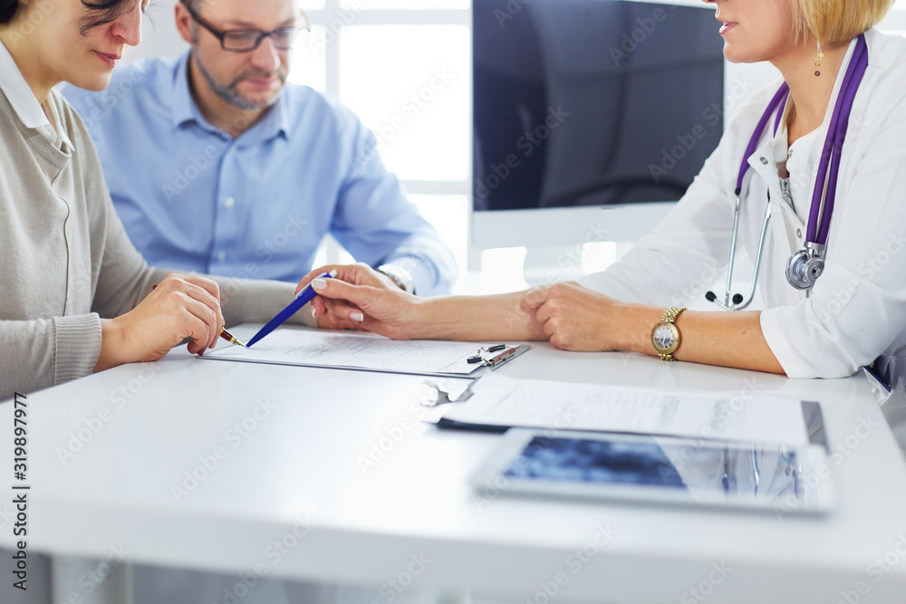 close up of patient and doctor prescribing medication close up of patient and doctor prescribing medication