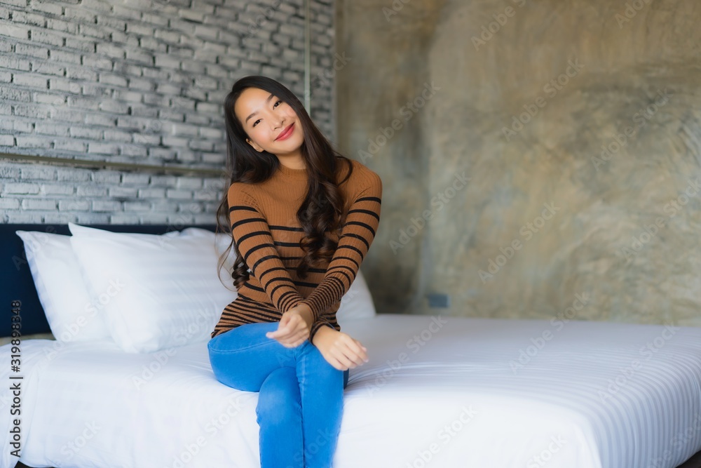 Young asian woman happy smile relax on bed in bedroom Young asian woman happy smile relax on bed in bedroom
