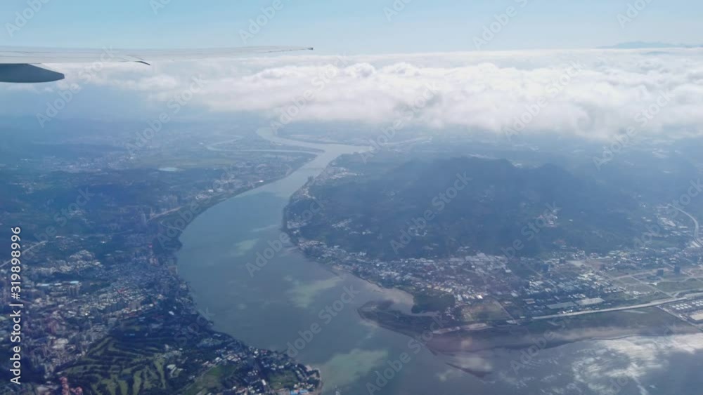 Sunny aerial sky landscape from and airplane window seat Sunny aerial sky landscape from and airplane window seat