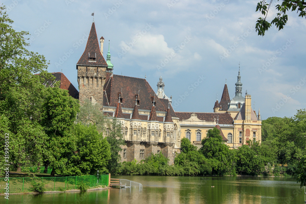 Vajdahunyad Castle and the lake of City Park. Beautiful spring landscape in Budapest, Hungary.