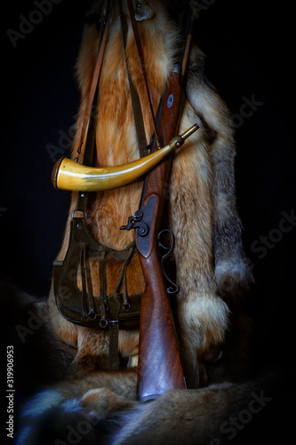 Muzzleloader Rifle with Accessories and Pelts