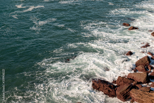 Rocky sea shore seen from the heights in Donostia, San Sebastian, Spain
