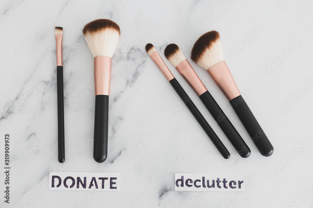 beauty industry and make-up products, variety of make-up brushes split into Keep and Declutter labels symbol of minimalism lifestyle beauty industry and make-up products, variety of make-up brushes split into Keep and Declutter labels symbol of minimalism lifestyle