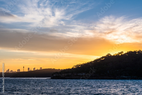 Backlight skyline of Sydney CBD from the bay at sunset
