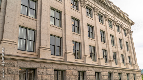 Panorama Building facade with decorative mouldings on the white stone exterior wall