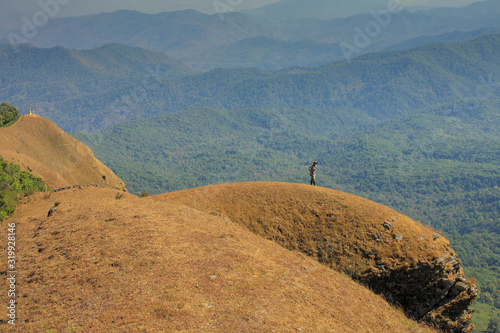 Golden meadow and mountains during sunset. Beautiful natural landscape in the winter time thailand