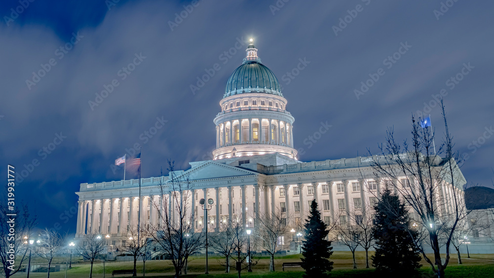 Photo Panorama Utah State Capital Building glowing against sky and clouds in Salt Lake City