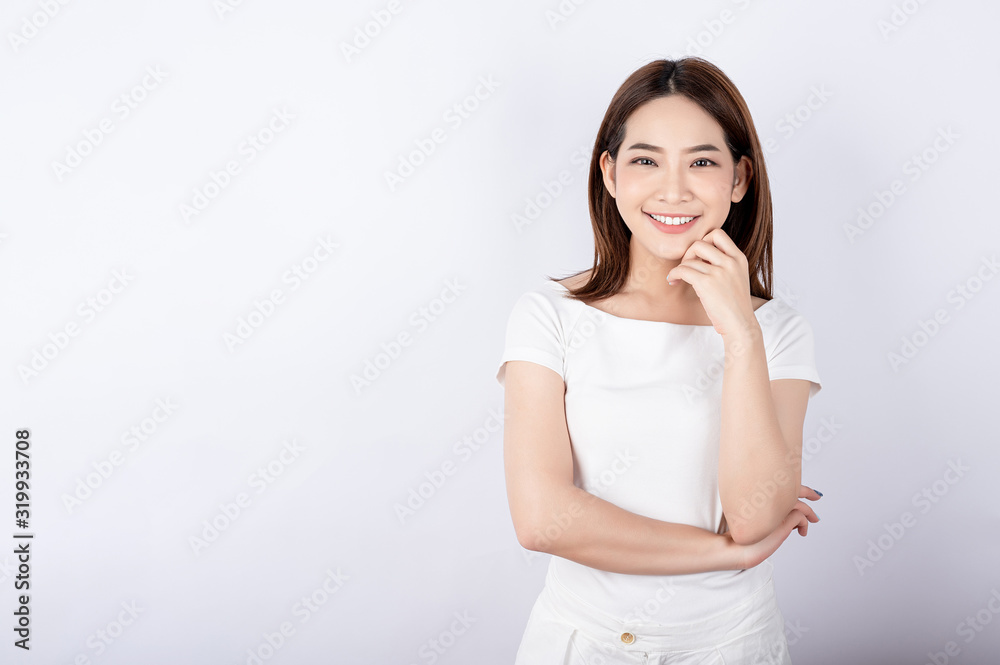 Beautiful young asian stand and pose with big smile happy beaming face in white background. Beautiful young asian stand and pose with big smile happy beaming face in white background.