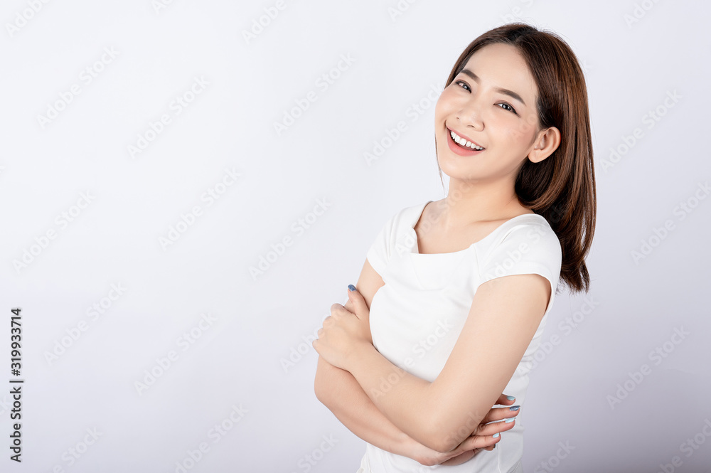 Beautiful young asian stand and pose with big smile happy beaming face in white background. Beautiful young asian stand and pose with big smile happy beaming face in white background.