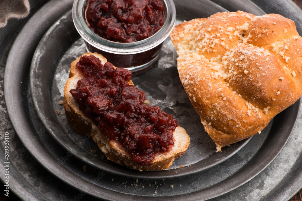 Sweet bread (challah) with cherry jam
