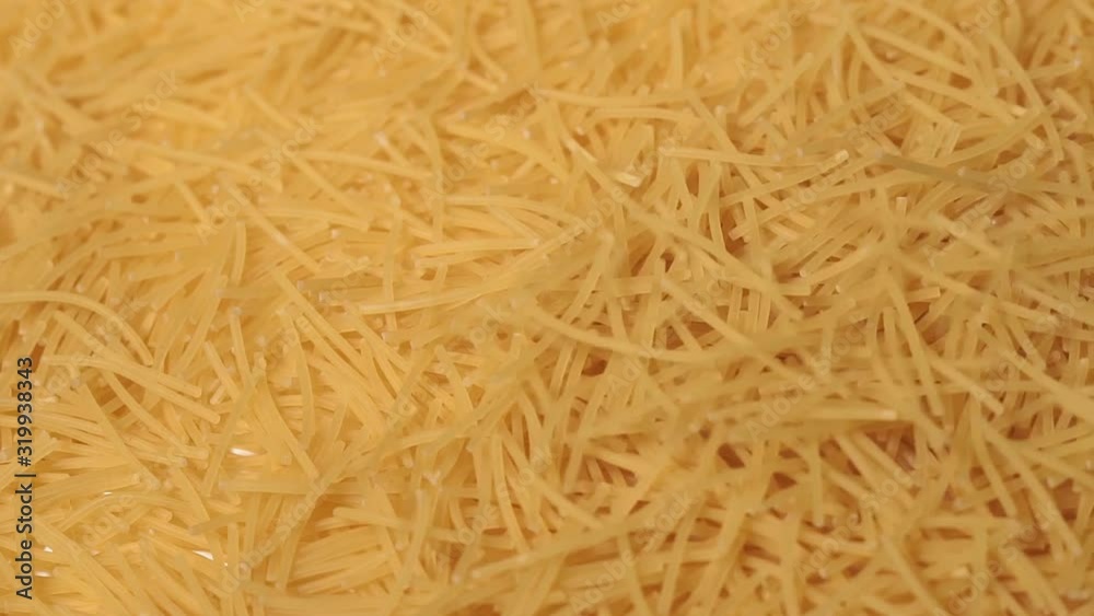 macaroni close-up macro. bunch of uncooked noodles. macaroni close-up macro. bunch of uncooked noodles.
