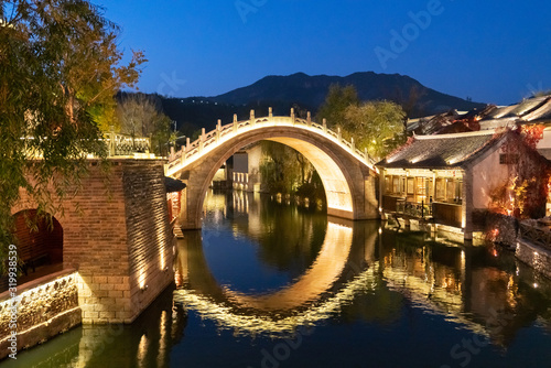 Night view of Yinjian Bridge in Beijing Wtown（Gubei Water Town）, China