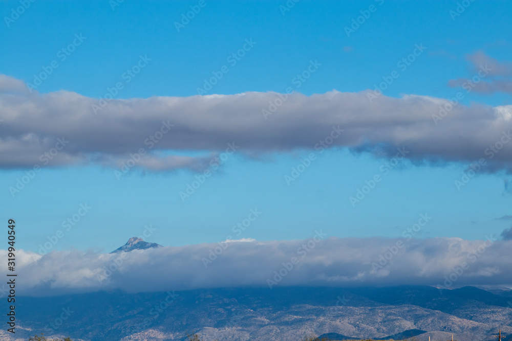 Clouds and mountain peaks