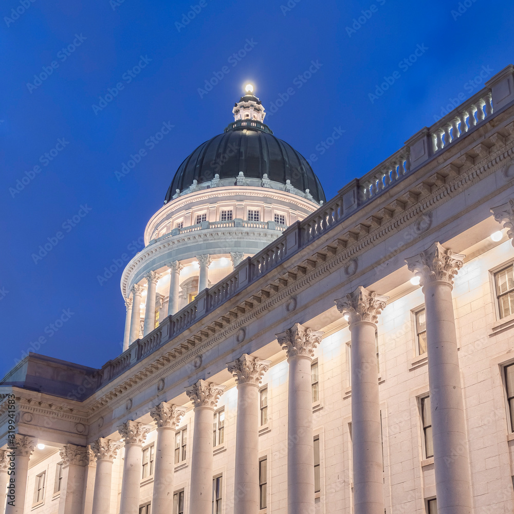 Photo Square Utah State Capital Building in Salt Lake City glowing against vibrant blue sky