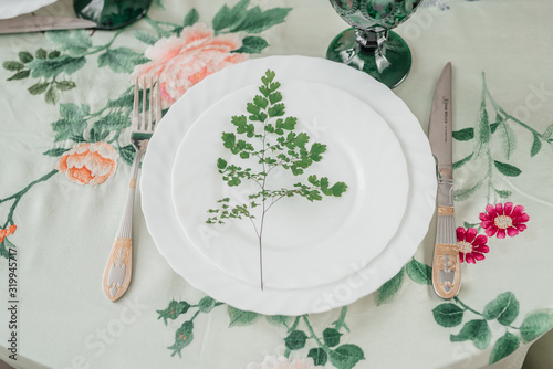  table setting on a vintage tablecloth with embroidery