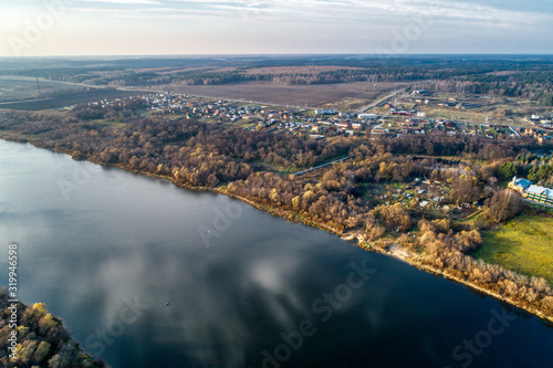 Fototapeta Naklejka Na Ścianę i Meble -  Wide big river. Autumn landscape, aerial view.