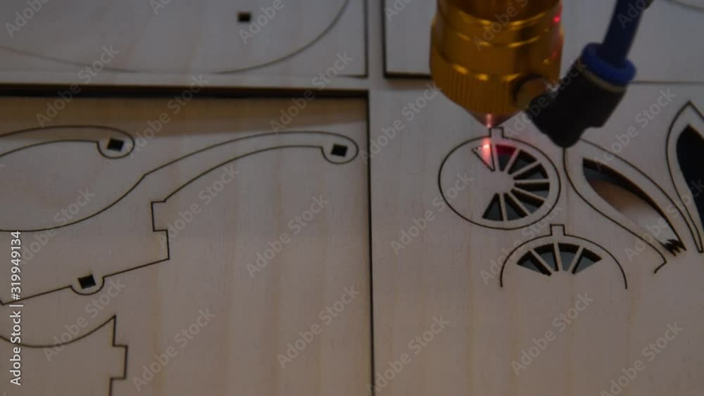 Wood laser cut machine at work
