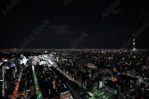ILLUMINATED CITYSCAPE AGAINST SKY AT NIGHT © daisuke enomoto/EyeEm