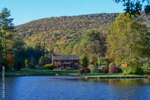 House by the lake at Glen Alton Recreation Area in autumn, Blacksburg, Virginia, USA. Main Lodge House. Beautiful scenery with autumn background. photo