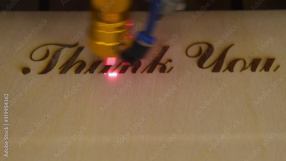 Creating engraving on wood with laser beam