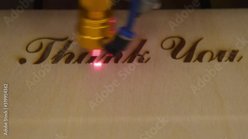 Creating engraving on wood with laser beam