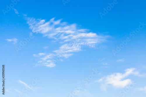 White clouds formations in blue sky, background photo